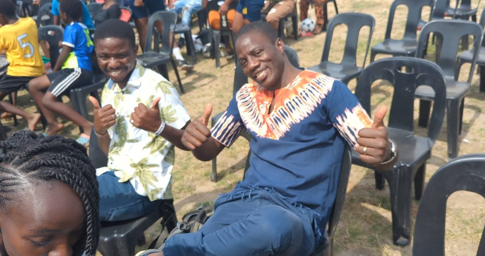 Friends sharing a joyful moment in community at YWAM Lusaka