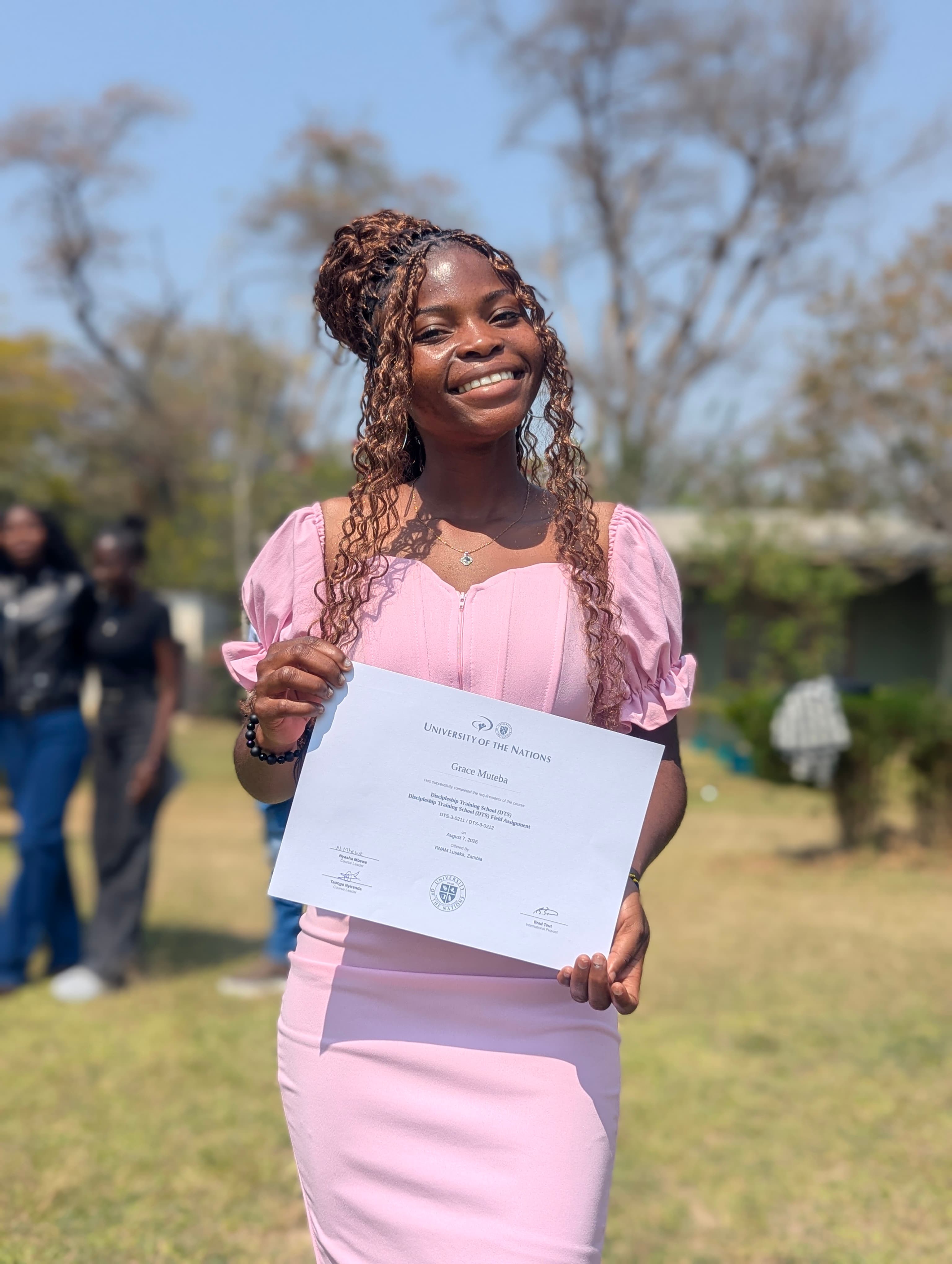 A student celebrating the completion of training