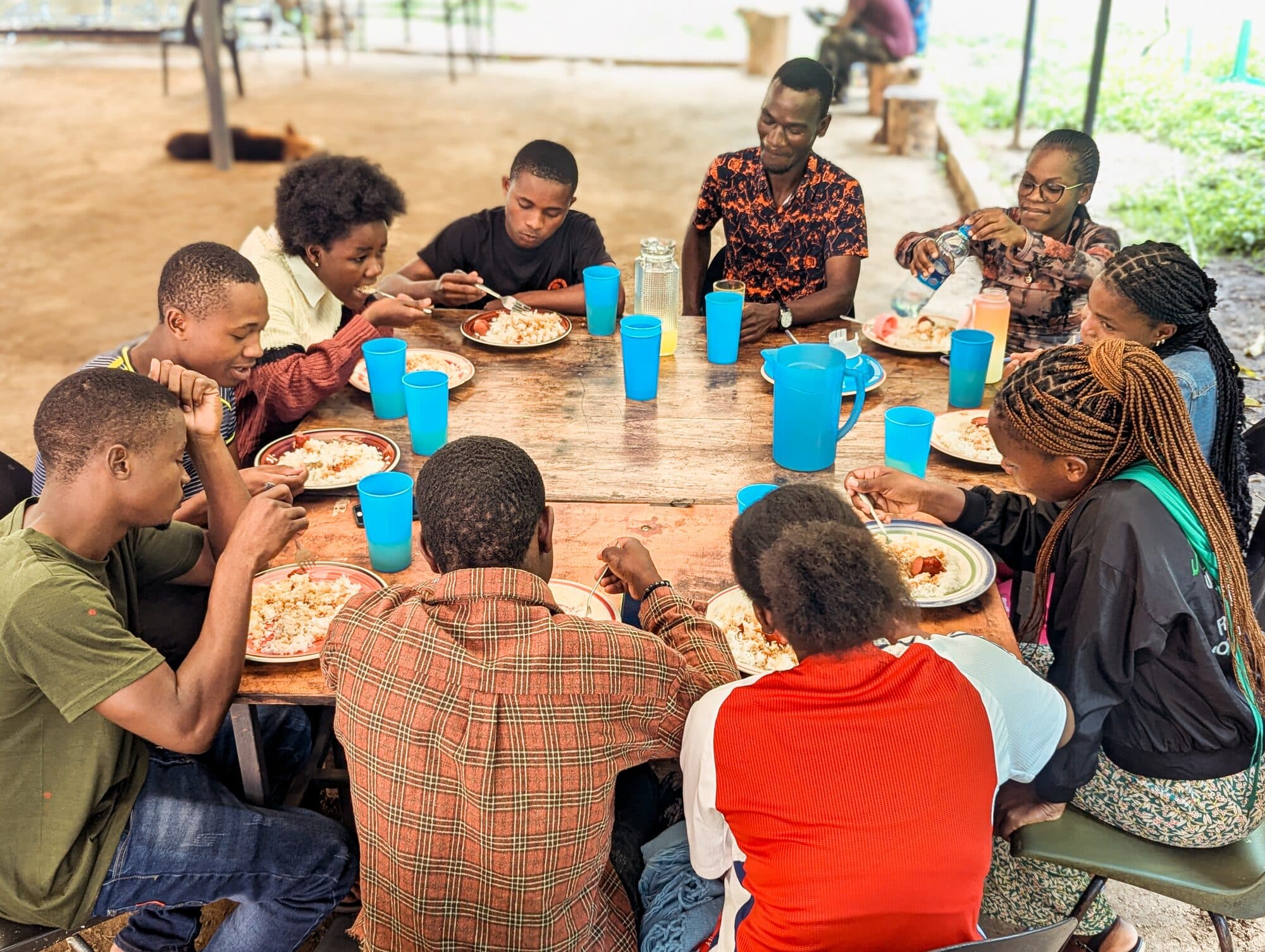 Children sharing a meal at the base